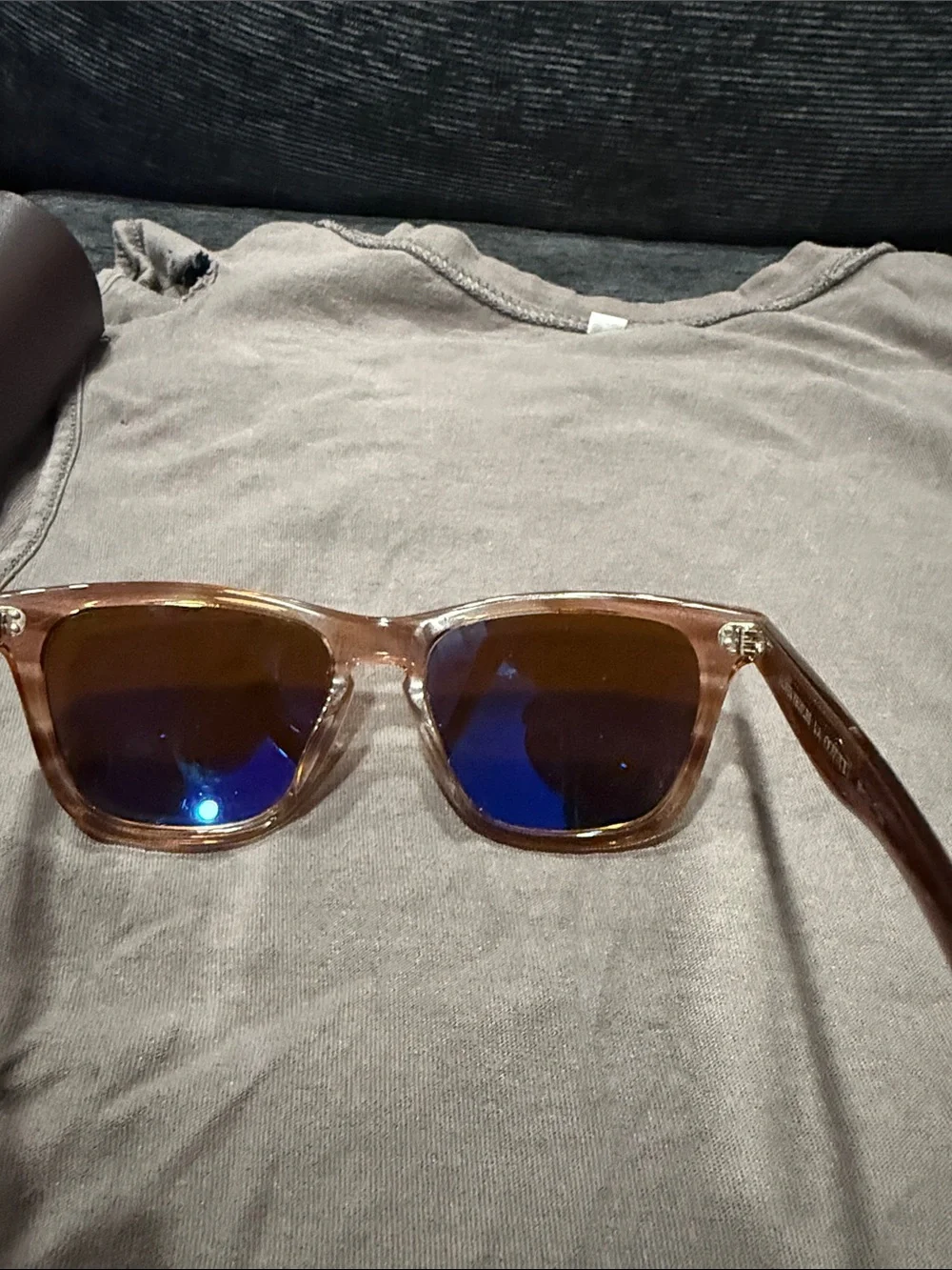 Oliver Peoples Brown Transparent Frame Sunglasses with Brown Lenses.